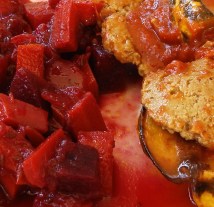 Bbq seitan with acorn squash; spiced beets and carrots close up