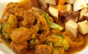 Tamari tempeh with broccoli in kabocha squash sauce; roasted potatoes and butternut squash in red onion broth close up